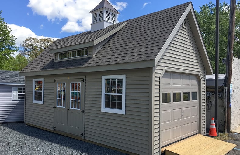 Vinyl Shed with garage door can add value to your home.