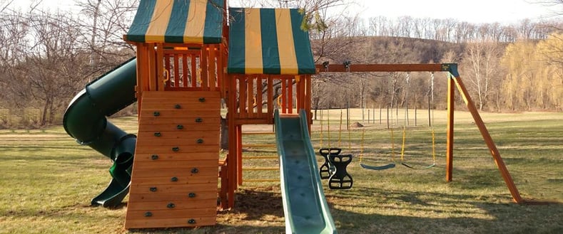 Fantasy Swing Set. With some help from Swingset Warehouse a beautiful swing set can fit nicely with your landscaping.