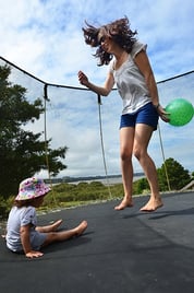 Mom and Daughter on Trampoline