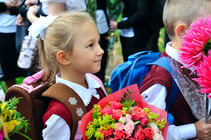 On the first day of school in Russia, children bring flowers to their teachers.