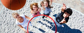 Teens playing basketball