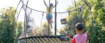 People at any age find joy when playing on a trampoline.
